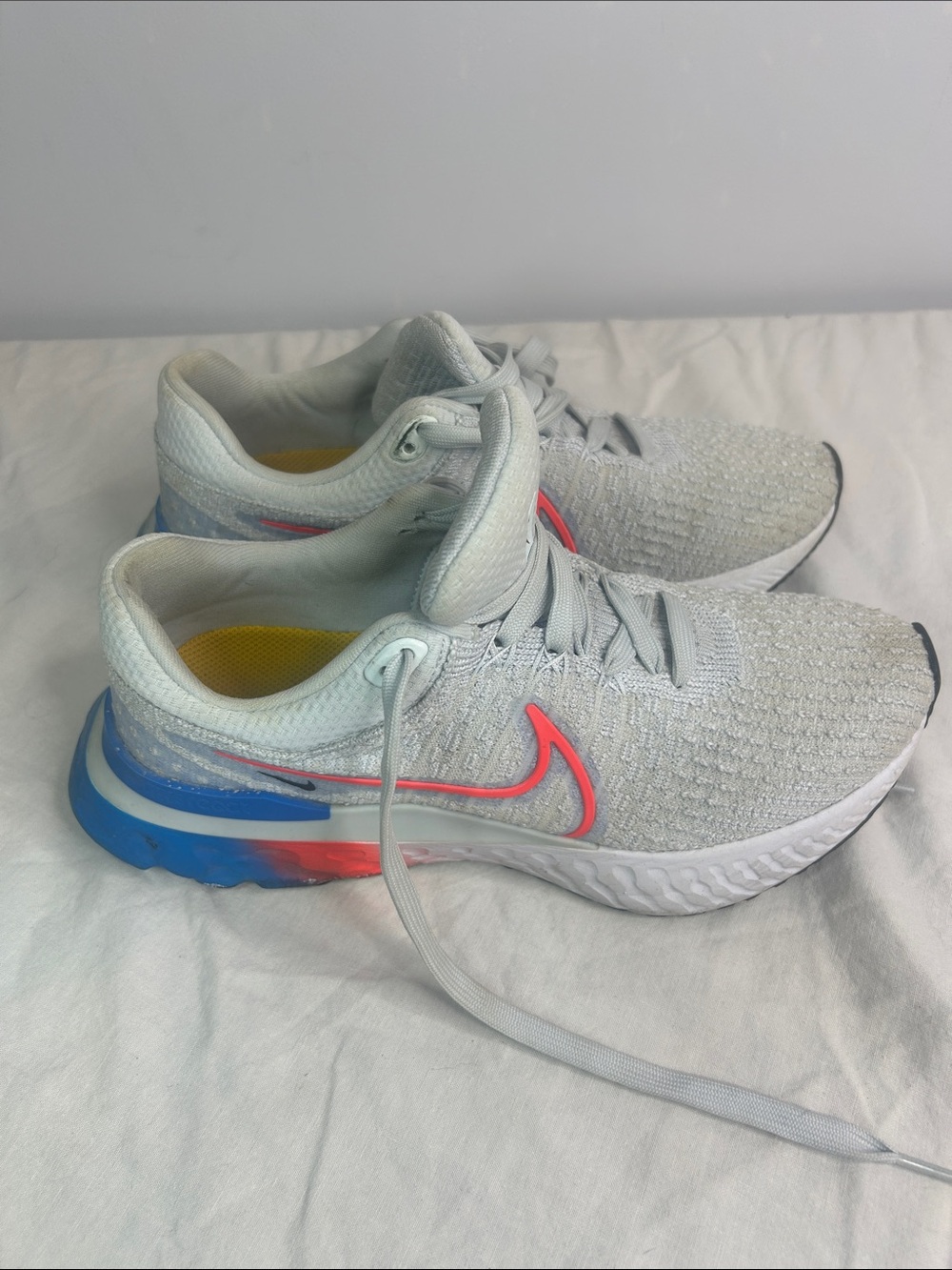 Nike Light Grey Sneakers with Pink & Blue Accents